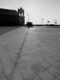 Footpath by building against sky