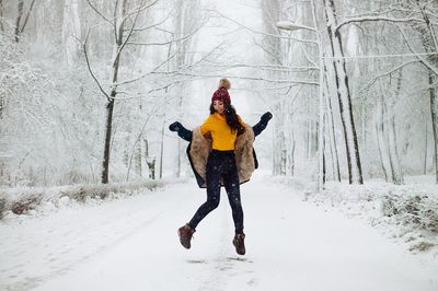 Full length of man on snow covered field