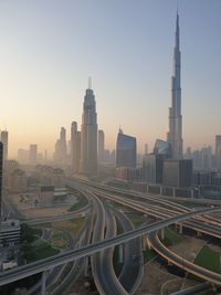 View of city buildings against clear sky