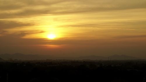 Scenic view of silhouette landscape against romantic sky at sunset