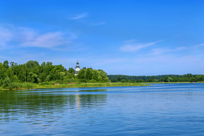 View of lake against blue sky