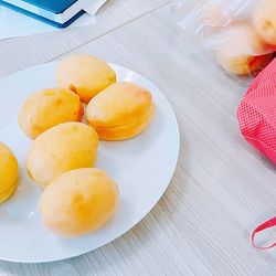 High angle view of fruits in plate on table