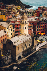 High angle view of townscape by sea