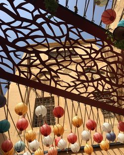 Low angle view of lanterns hanging on ceiling