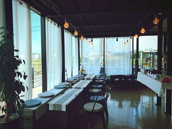 Empty chairs and tables in restaurant