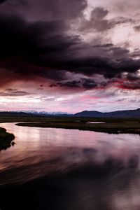 View of storm clouds over landscape