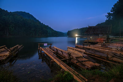 Scenic view of lake against sky at dusk