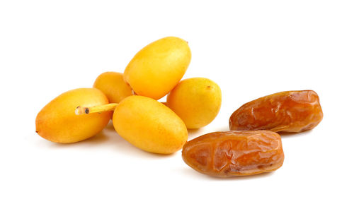 Close-up of oranges against white background