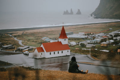 View of sea and buildings against sky