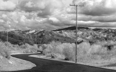 Scenic view of mountains against cloudy sky