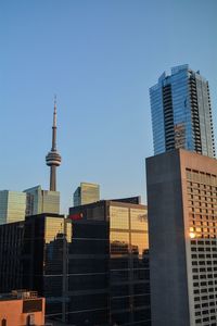 Low angle view of modern buildings against clear sky