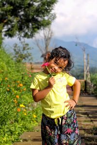 Girl holding flower in the park