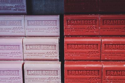 Stack of pink and red soap in market