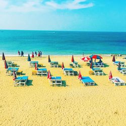 Sun loungers on calm beach