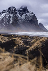 Scenic view of sea against mountain