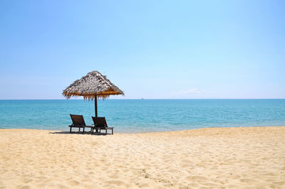 Sun loungers on calm beach