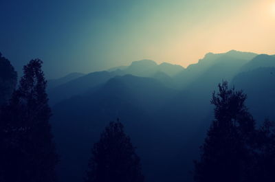 Scenic view of mountains against sky during sunset