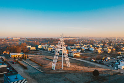 High angle view of buildings against clear sky at sunset