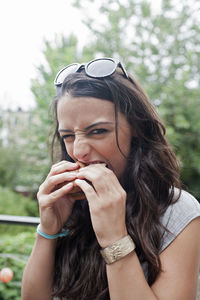 Young woman eating a hamburger