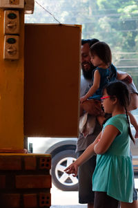 Family at the hawker stall waiting for the food.