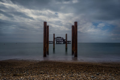 Pier over sea against sky