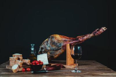 Close-up of food on table against black background