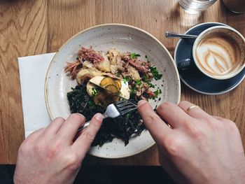 High angle view of person preparing food on table