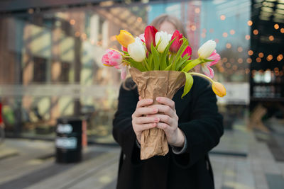 Close-up of woman holding umbrella