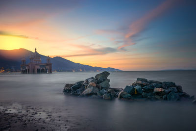 Scenic view of sea against sky during sunset