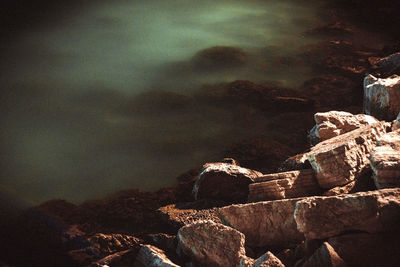 Low angle view of rocks at night