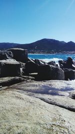 Scenic view of sea against clear blue sky
