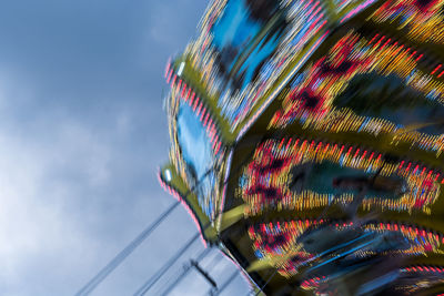 Low angle view of ferris wheel against sky