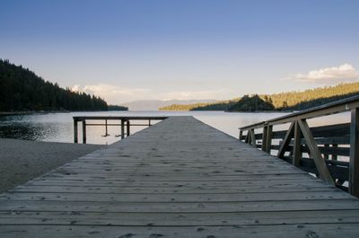 Pier over lake against sky