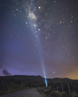 Scenic view of mountains against sky at night