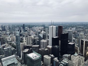 High angle view of modern buildings in city against sky