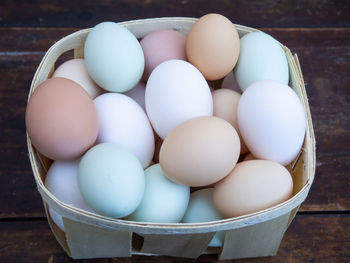 High angle view of eggs in basket on table