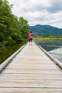 Full length of woman on lake against sky