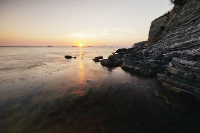 Scenic view of sea against sky during sunset