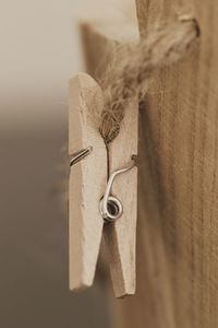 Close-up of clothespins hanging on rope