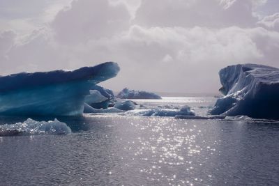 Scenic view of sea against sky during winter