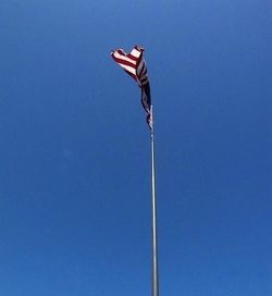 Low angle view of pole against clear blue sky