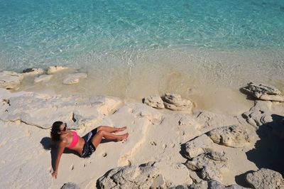 Woman standing on beach