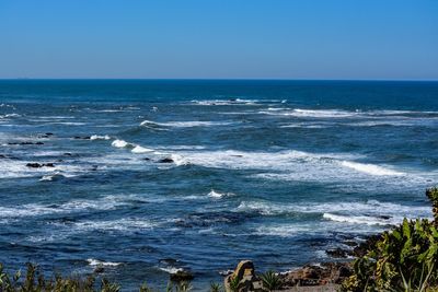 Scenic view of sea against clear sky