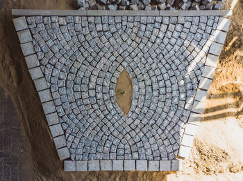 High angle view of manhole on footpath