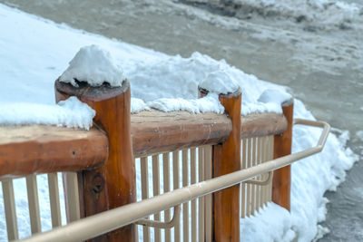 Close-up of frozen wooden railing