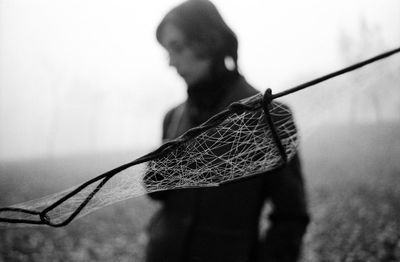 Close-up of woman holding plant