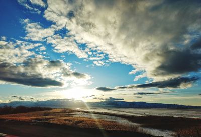 Scenic view of land against sky during sunset