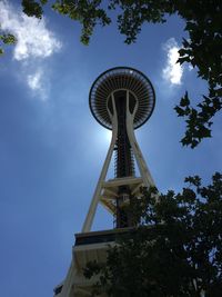 Low angle view of tower against cloudy sky