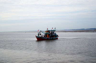 Boat on sea against sky