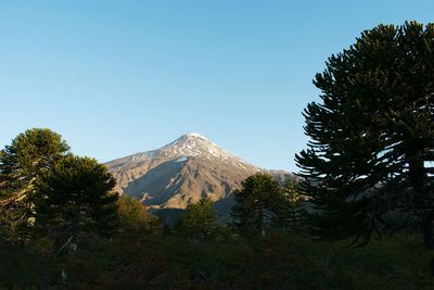 Scenic view of snowcapped mountains against clear sky